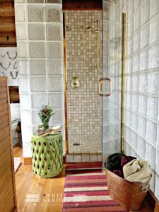 Master Bathroom, Bathroom, Tiled Shower, Shower Stool, Antler Print, Painted Fox Home, Log Home, Log Cabin, Glass Block Wall