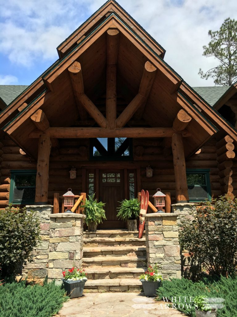 log home, log cabin, front porch, ferns, vintage water skis
