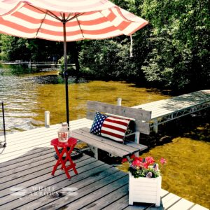 dock, stripped umbrella, lake hous