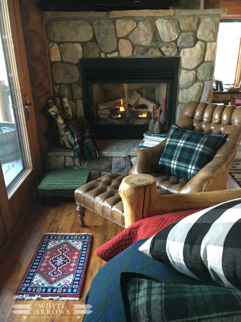 hygge, gas fireplace, plaid decor, log cabin, cabin, lake house, cabin decor