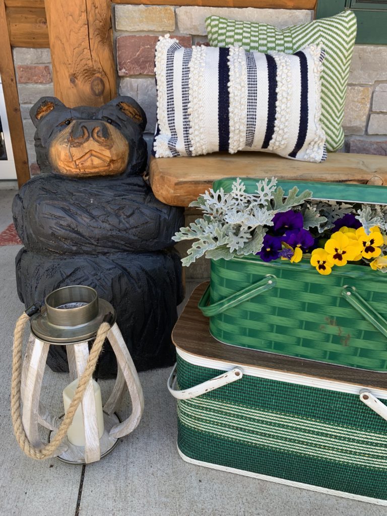 spring-summer-porch-cabin-carved-bear-vintage-picnic-basket-pansies