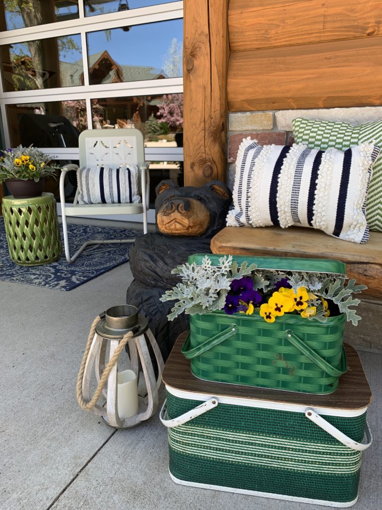 spring-summer-porch-cabin-carved-bear-vintage-picnic-basket-pansies