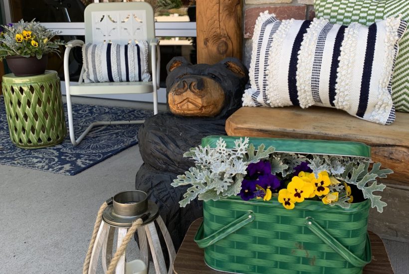 spring-summer-porch-cabin-carved-bear-vintage-picnic-basket-pansies
