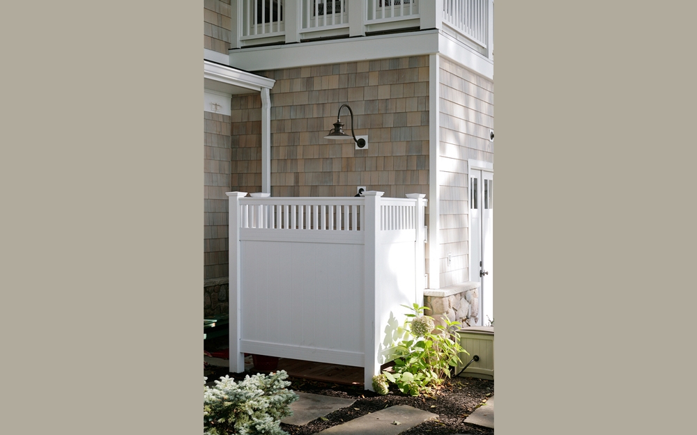 Outdoor Shower with White privacy fencing