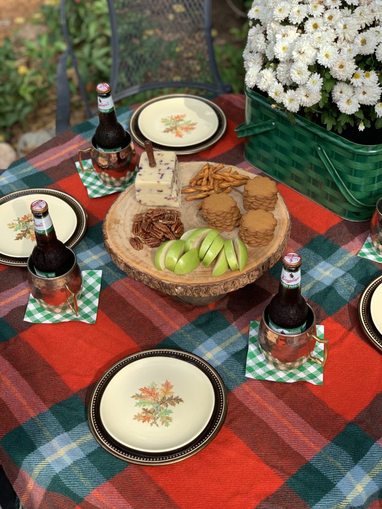 fall outside table set with plaid and copper