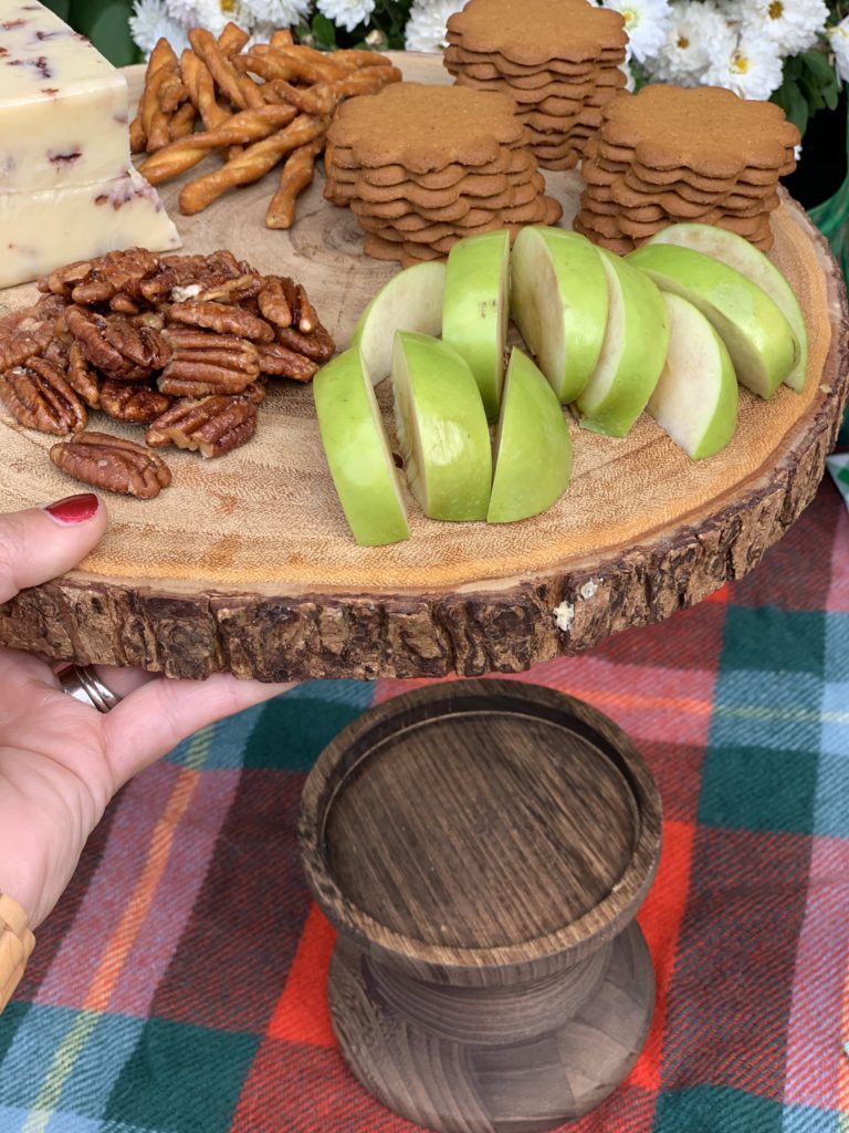 wooden tray holds apples and fall treats