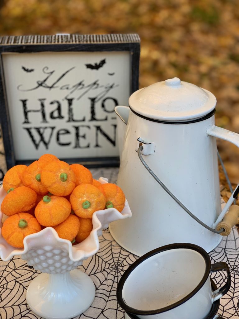 Enamelware coffeepot and mugs with pumpkin marshmallows