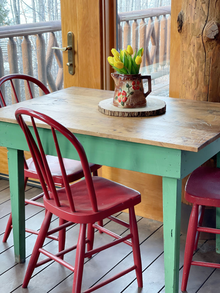 Sunroom table with vase of tulips