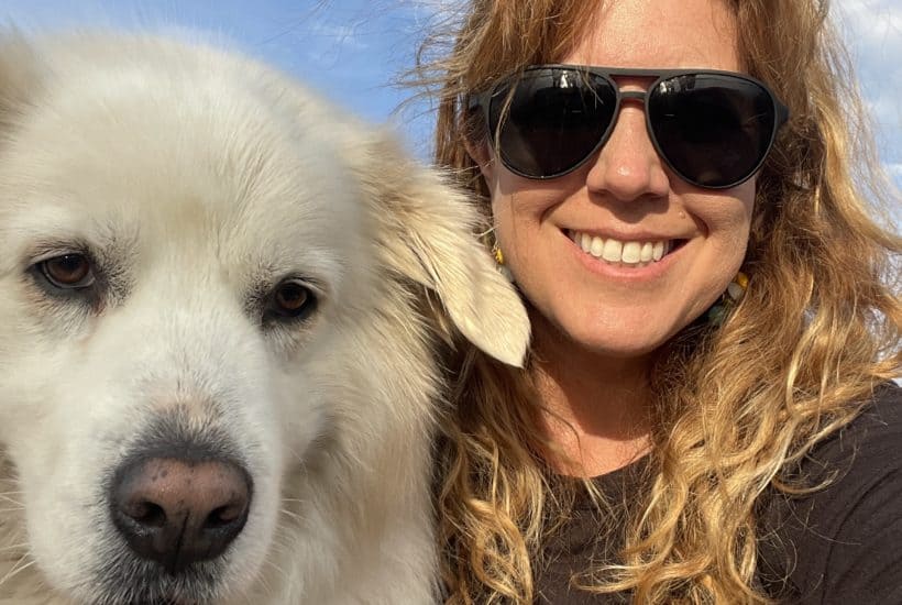 Kristin and Honey, her Great Pyrenees on the boat