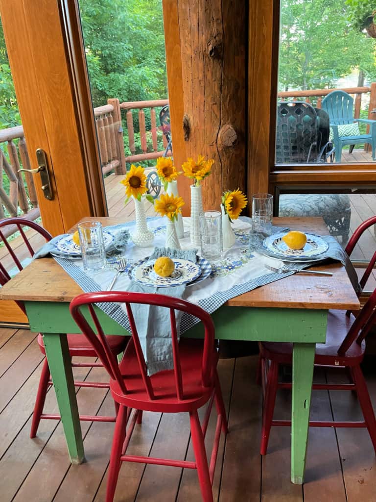 Sunroom Table set for Summer with blue and whites, vintage linens and lemons