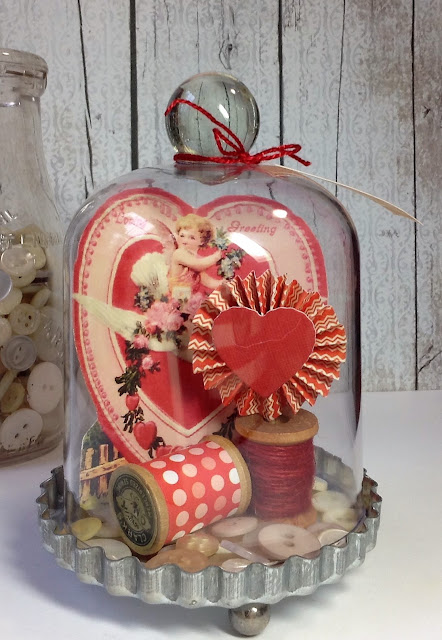 Valentine decor with a vintage card and cloche.