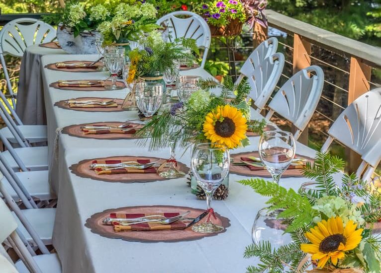 Rustic Tablescape with sunflowers on lakeside deck